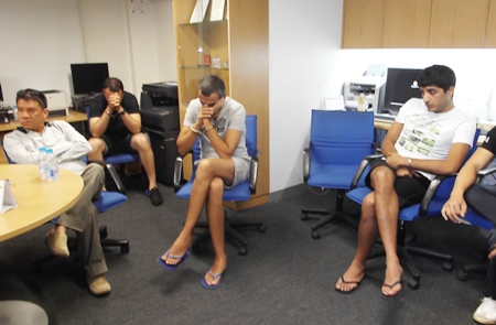 The perpetrators await processing at the Pattaya police station.